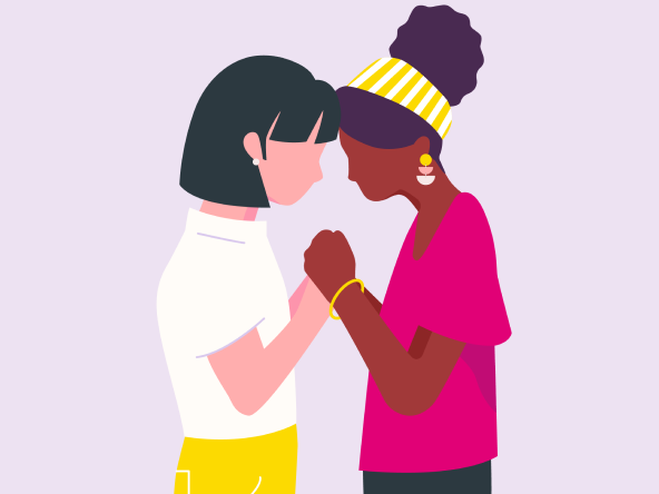 Two women holding hands representing support