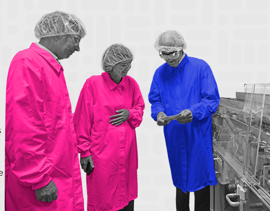 Organon employees in lab coats at manufacturing plant representing product quality